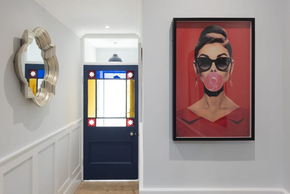 Artwork on the walls in the hallway with internal staircase - Mermaids 3