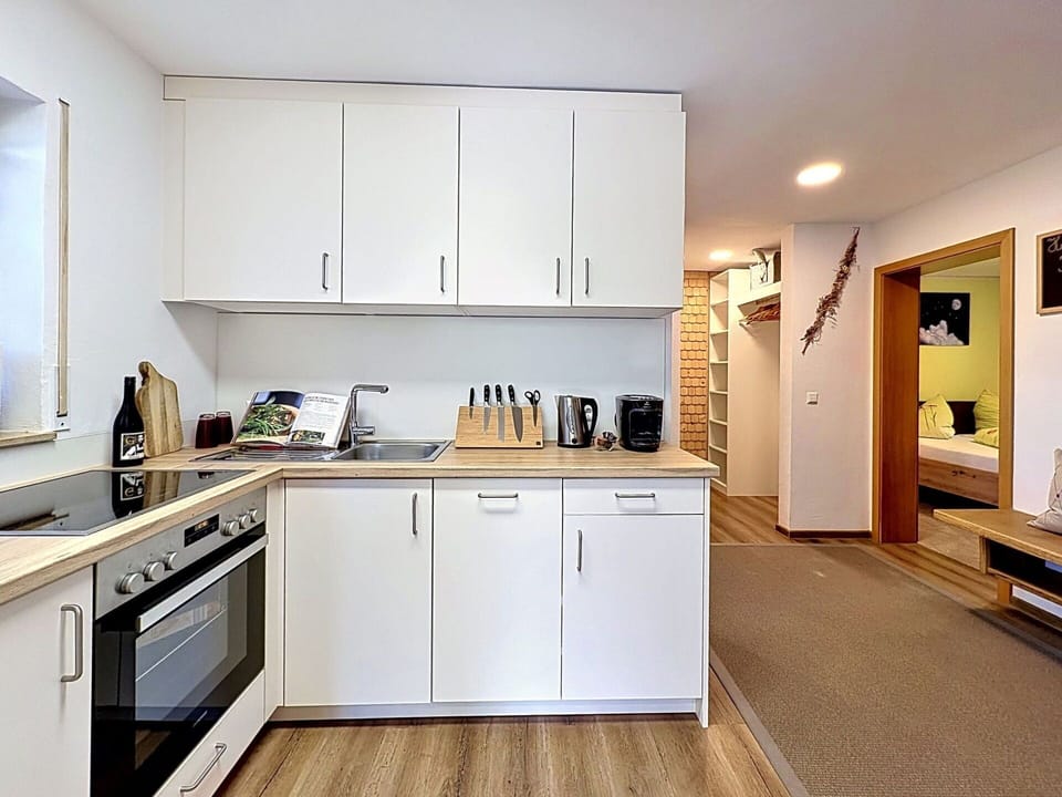 Kitchen Appliance, Kitchen, Furniture, Interior Design, Flooring, Major Appliance, Countertop, Floor, Wood, Cabinetry