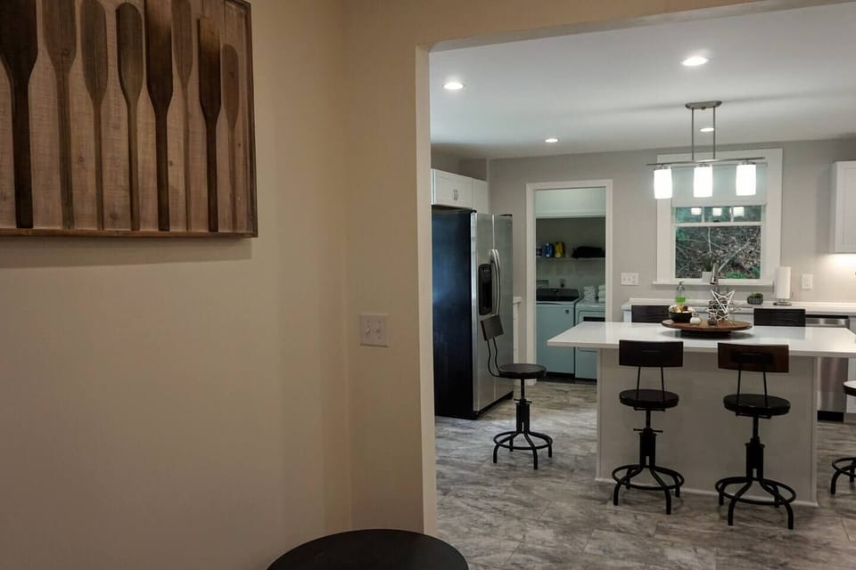Check out that island for cooking, chatting it up with family and friends or how about a fun game of Lakes Regionopoly or one of the other board games!