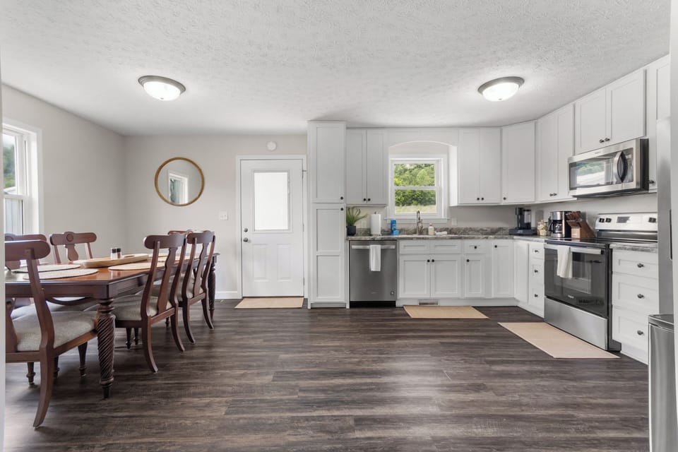 Large kitchen with a great dining space enough to seat 6. Access to the back porch as well.