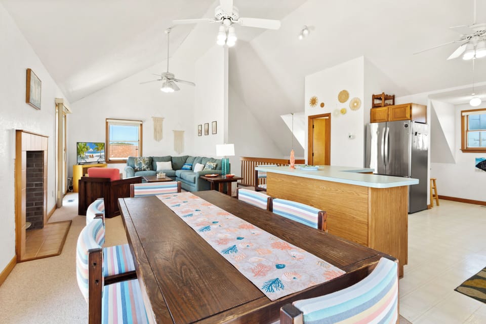 The dining space offers an ideal setting for family dinners and game nights.