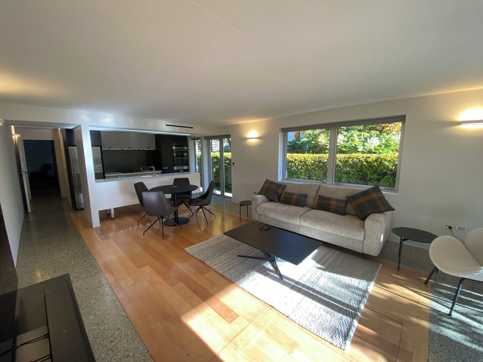Spacious living/dining room with gas fire, TV, sofa converts to Queen-size bed