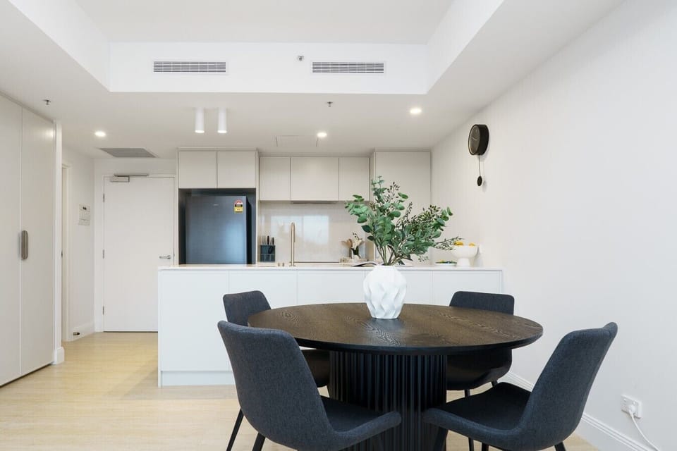 Start your morning with coffee or gather for dinner around the inviting dining table designed for easy entertaining.