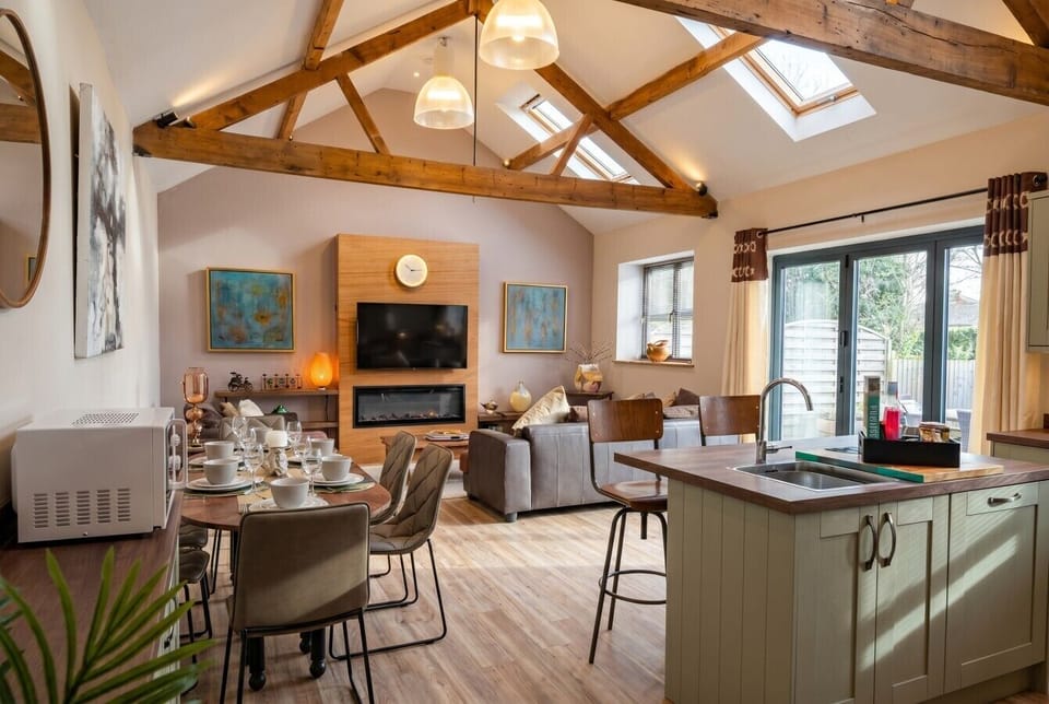 Bright open living and dining flows out to the garden through wide patio doors.