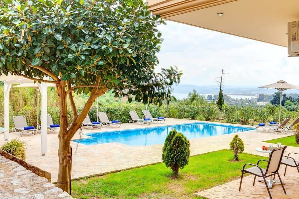 Peaceful outdoor spaces overlooking the shared pool, gardens, and the beautiful Cretan landscape.