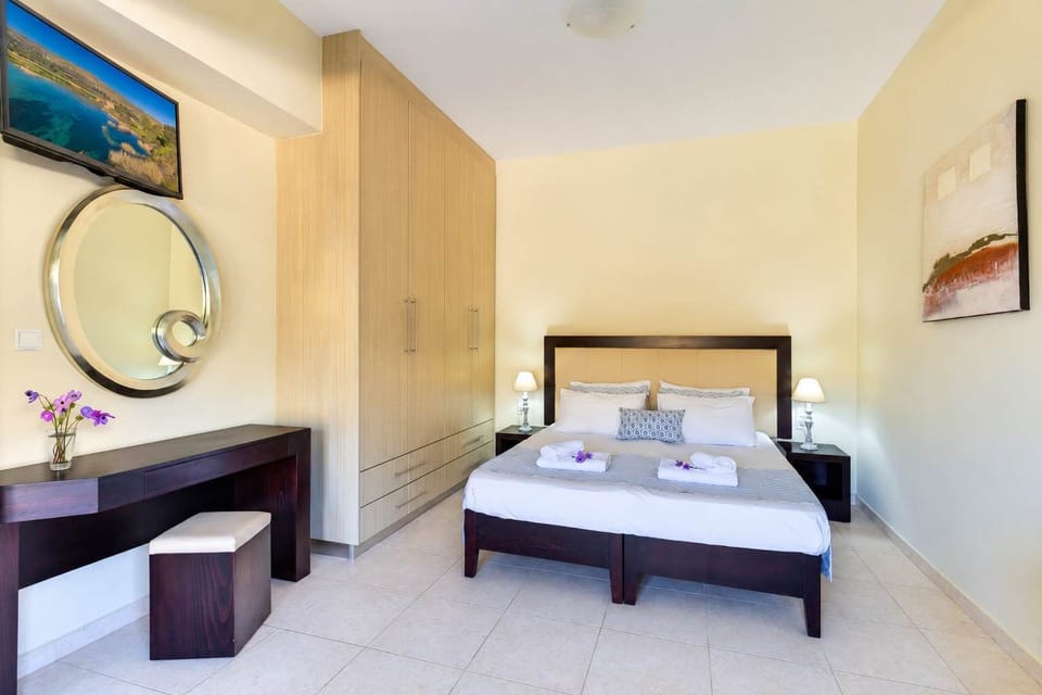 Comfortable double bedroom featuring quality bedding, ample storage, and a relaxing atmosphere.