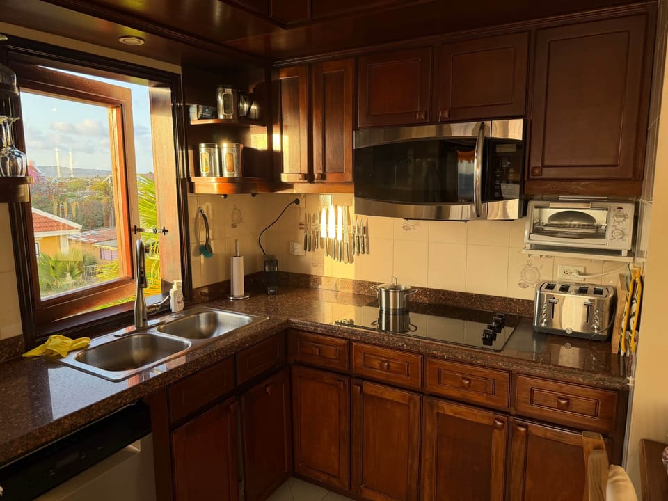 Cook with ocean views and enjoy a warm, fully equipped kitchen made for long stays.