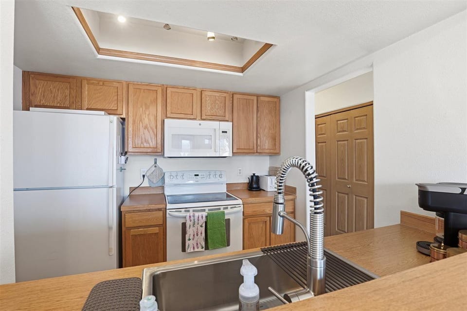 Spacious countertops and modern sink setup make cooking and cleanup convenient.