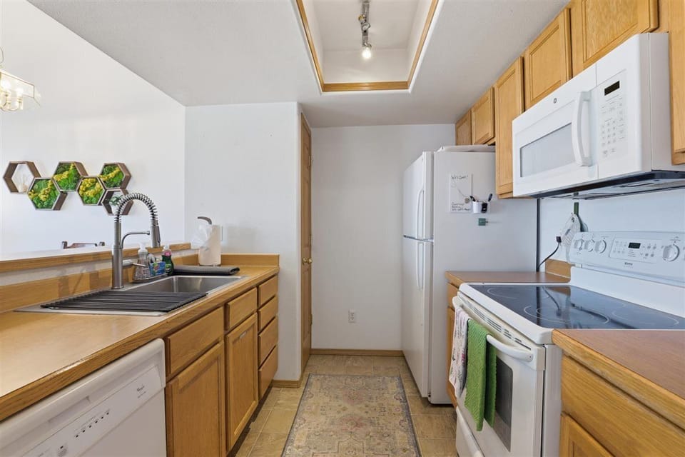 Open kitchen layout keeps everyone connected while cooking and dining together.