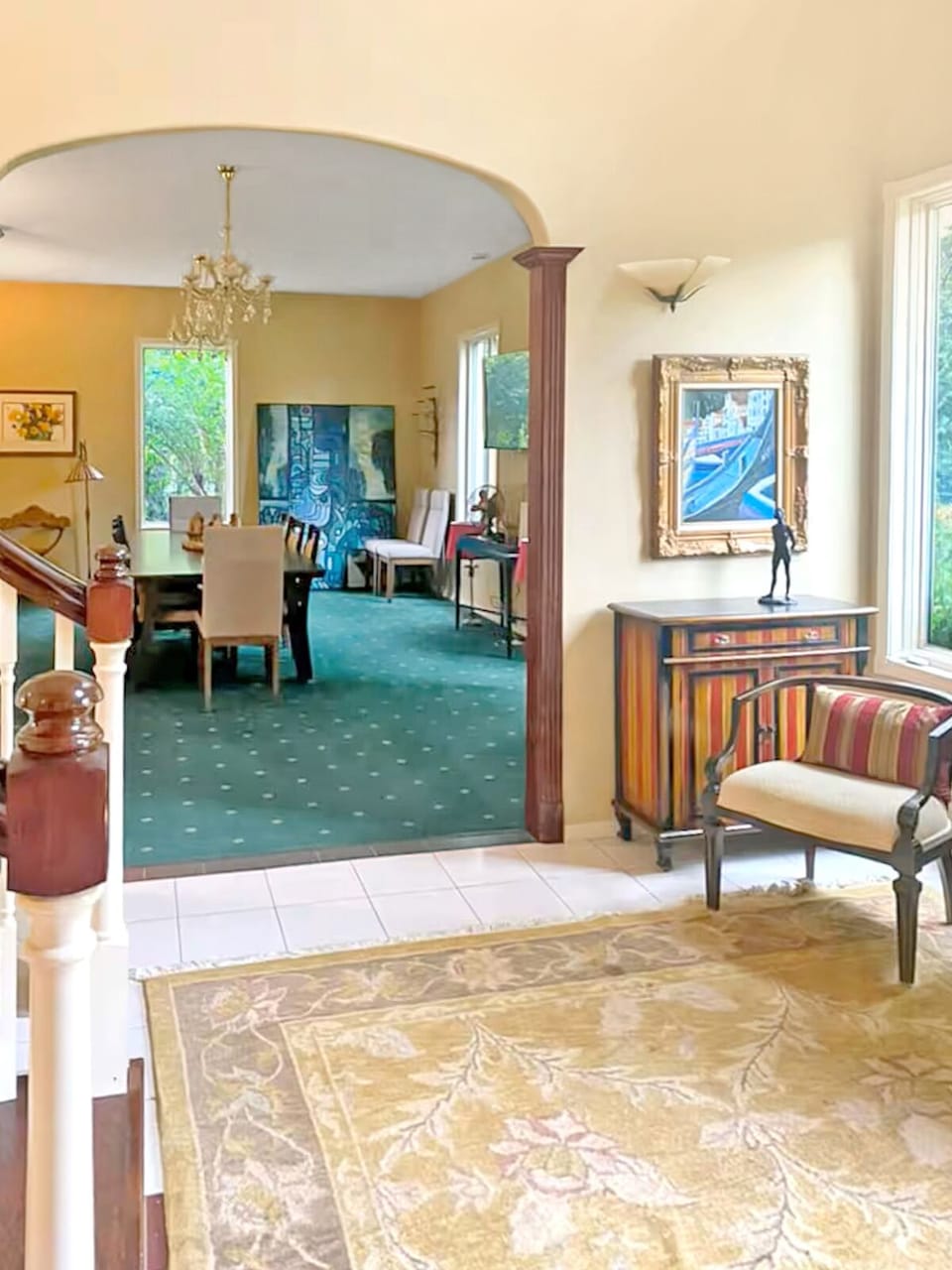 Bright and spacious entry opens to a formal dining room, formal living room and beautiful curved staircase.
