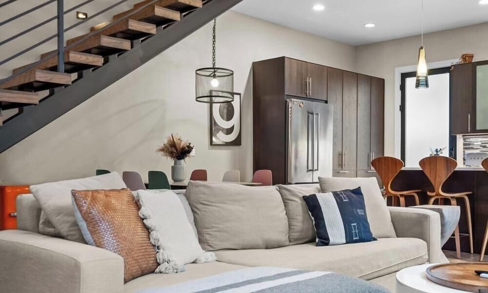 Spread out on the sectional with sightlines straight through to the kitchen, so the whole group stays connected.