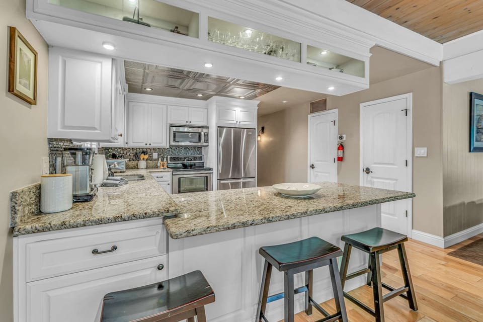 Kitchen: Drip coffee maker, tableware, cooking utensils
