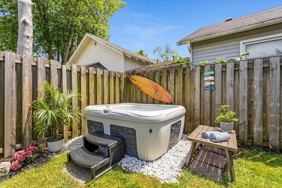 Relax and unwind in your private backyard hot tub—perfect for soaking under the stars after a day at the beach. This cozy spa retreat adds a splash of charm and serenity to your stay