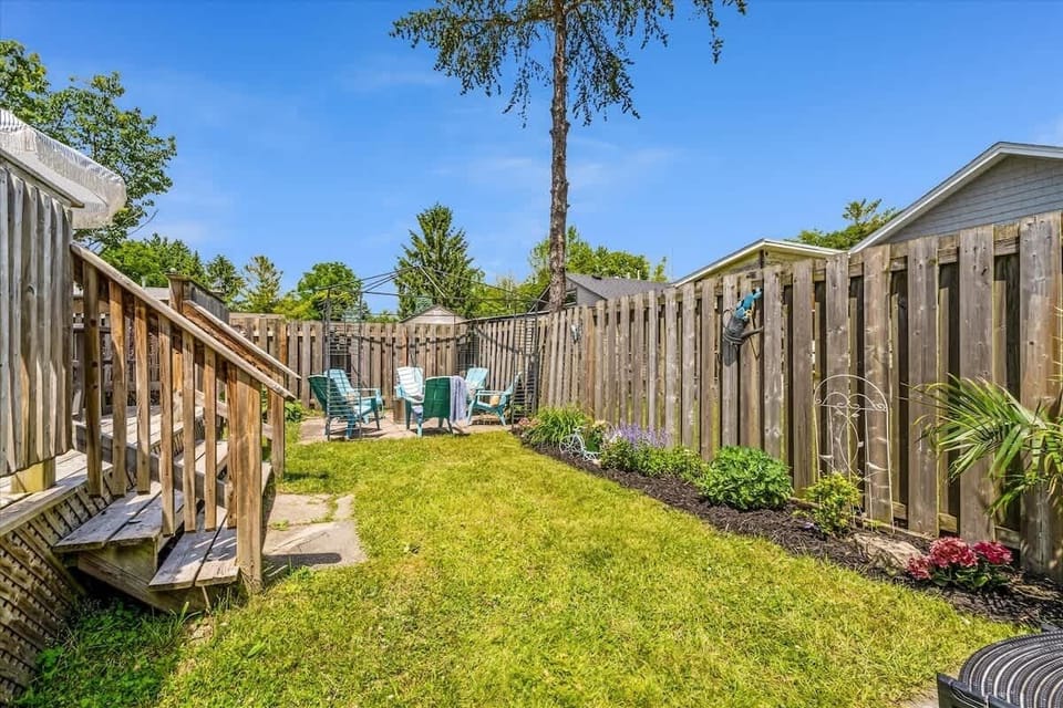 Gather in the sunny, private backyard for cozy evenings around the fire pit. With plenty of seating, garden views, and a peaceful vibe, it’s the perfect spot to unwind after a day at the beach.