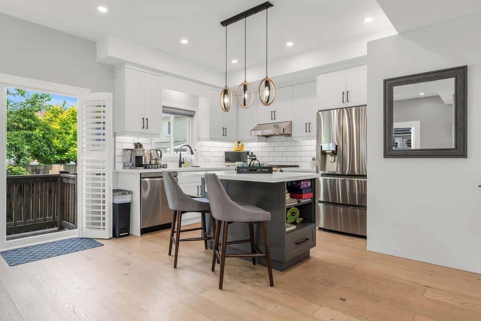 Modern Kitchen with Style & Functionality -Bright, kitchen for both comfort and convenience. Sleek appliances, spacious island with seating, perfect for cooking, gathering, or sipping your morning coffee.