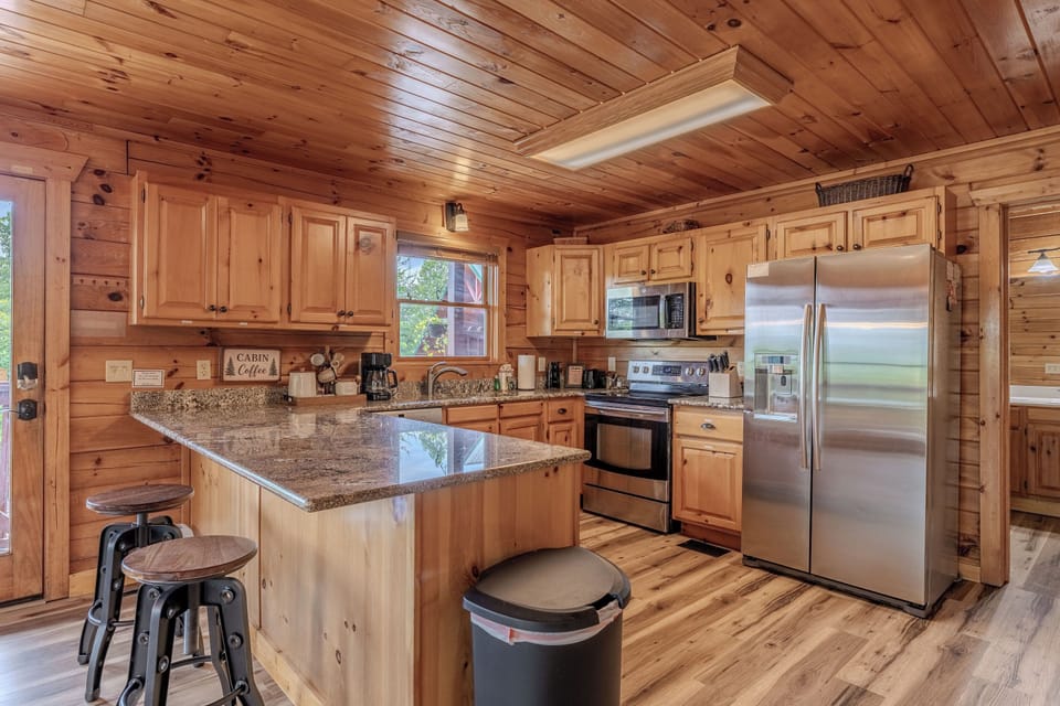 Fully equipped kitchen with stainless steel appliances, granite countertops, and everything you need for home-cooked meals.
