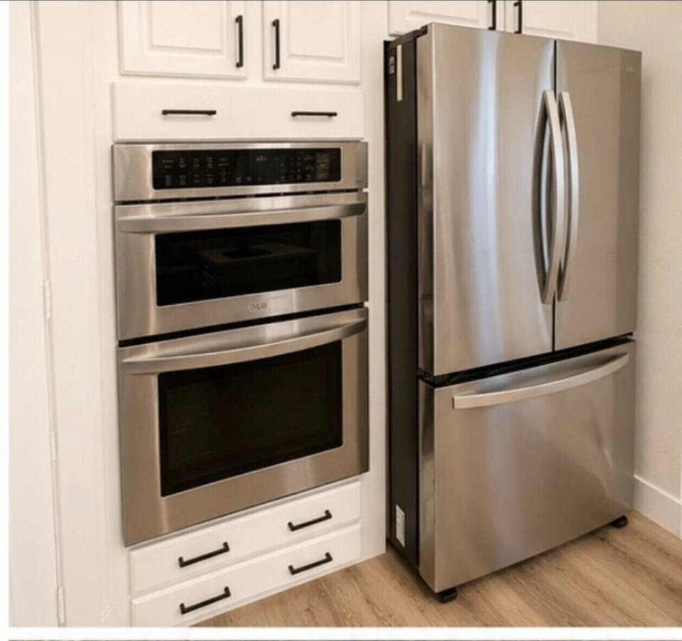 Fully equipped chef`s kitchen with double oven and full-size refrigerator — cook in just like home.