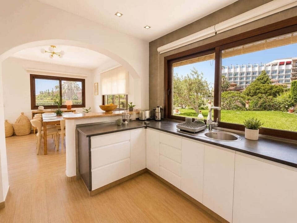 Kitchen and dining room with garden views