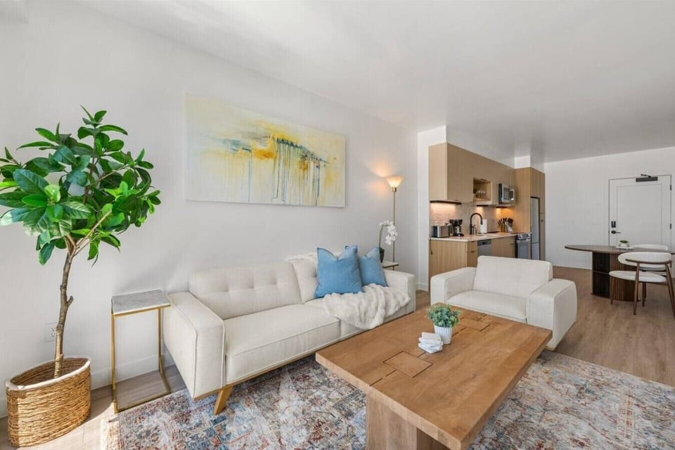 Highly designed living room with custom local art and lovely views! 75` Roku TV