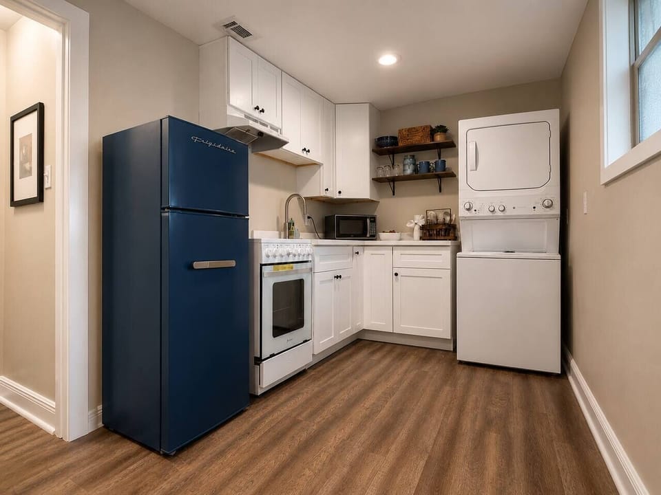 Full kitchen, big convenience.

This thoughtfully designed kitchen packs everything you need into a surprisingly spacious footprint, including a retro-style apartment refrigerator, full range, microwave, and in-unit washer/dryer.