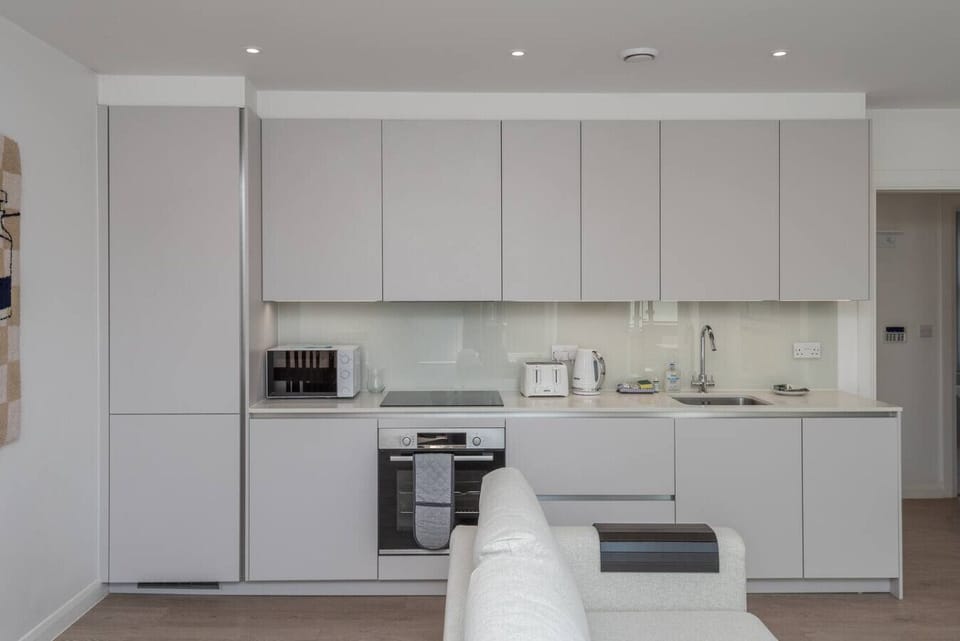 A sleek, fully equipped kitchen for easy meals and morning coffee.