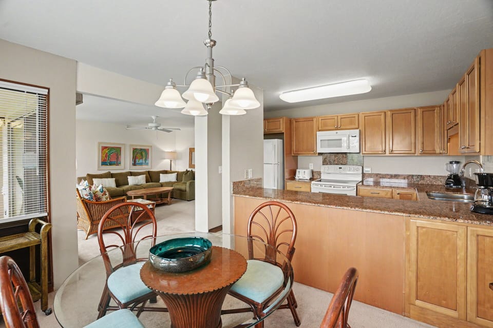 Your open-concept kitchen and dining space invites easy gatherings, with a fully equipped kitchen ready for your home-cooked meals and comfortable seating just steps from the living room.