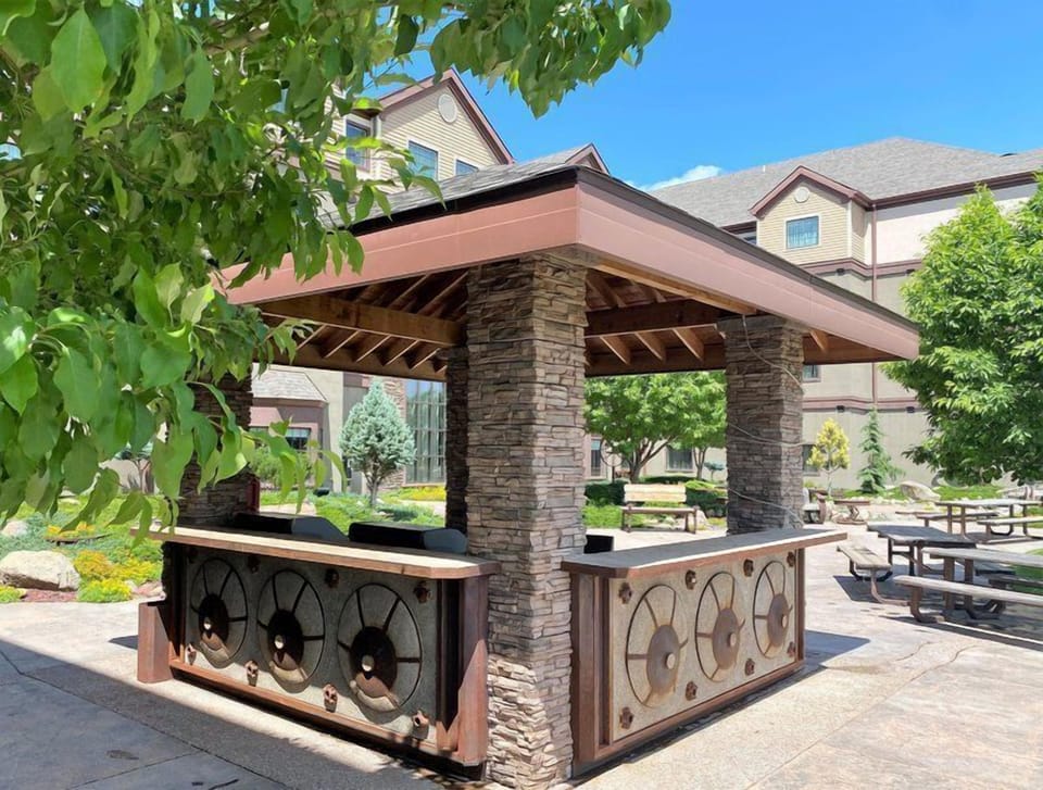Gather with friends at the stylish outdoor gazebo, an inviting spot for conversation and laughter.