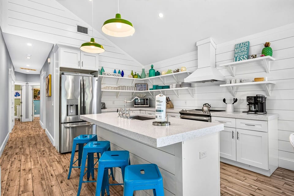 Bright coastal kitchen with large island and cheerful beachy style