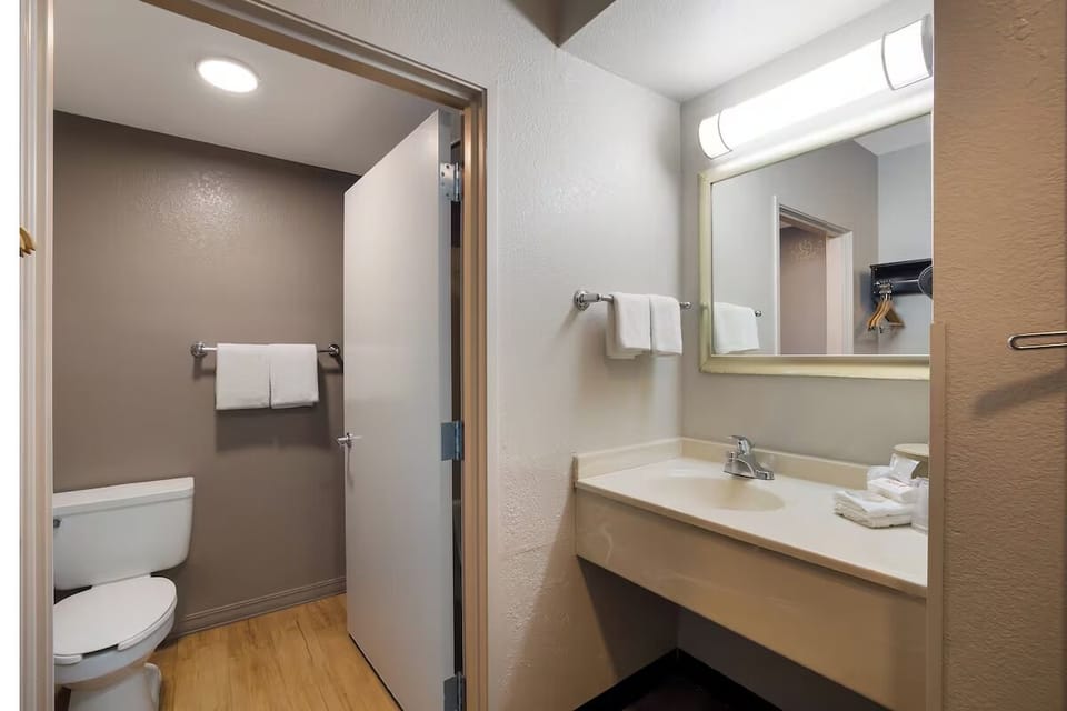 Freshen up with a bright vanity area and clean, fluffy towels.