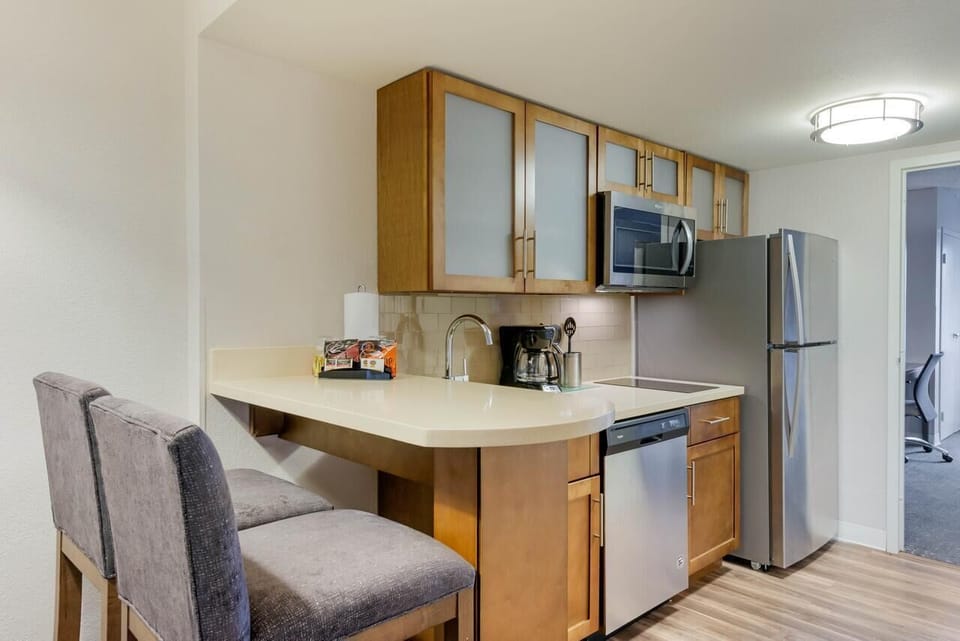 Cook quick meals in the modern kitchenette with bar seating.