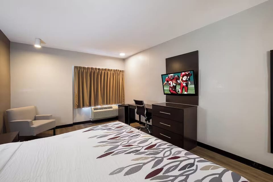 Wake up refreshed in a roomy king space with a cozy lounge chair.