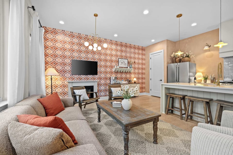 Open and airy, where the living room flows right into a fully stocked kitchen. Gather here, stay a while. 