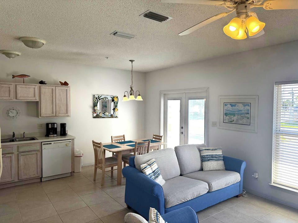 Living/Dining room area with doors to outdoor patio