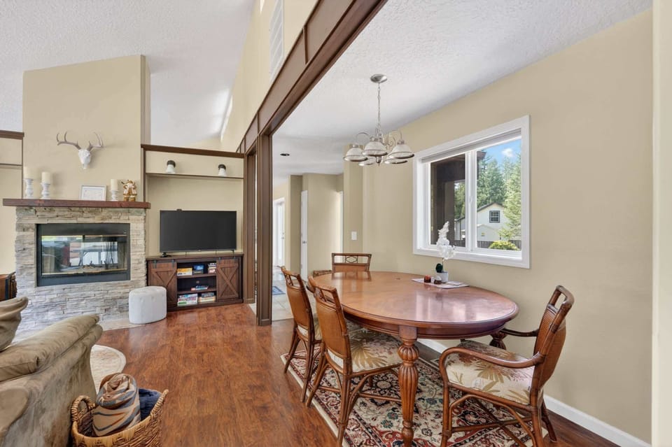 Dining table next to the fireplace.