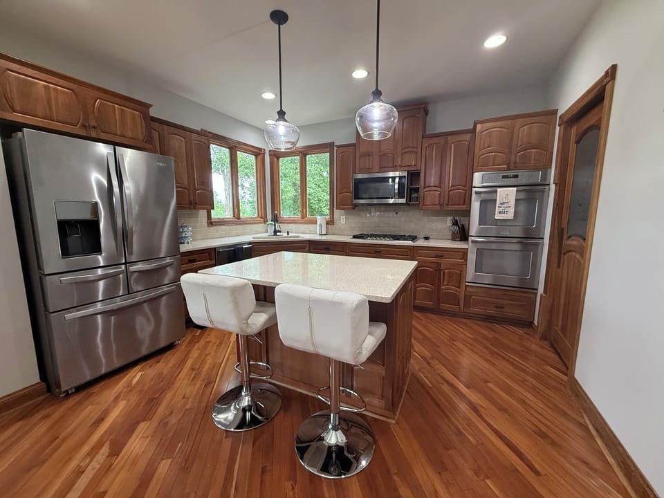 Kitchen with Island, Quarts Countertops, Double Oven, Stovetop, & Walk In Pantry