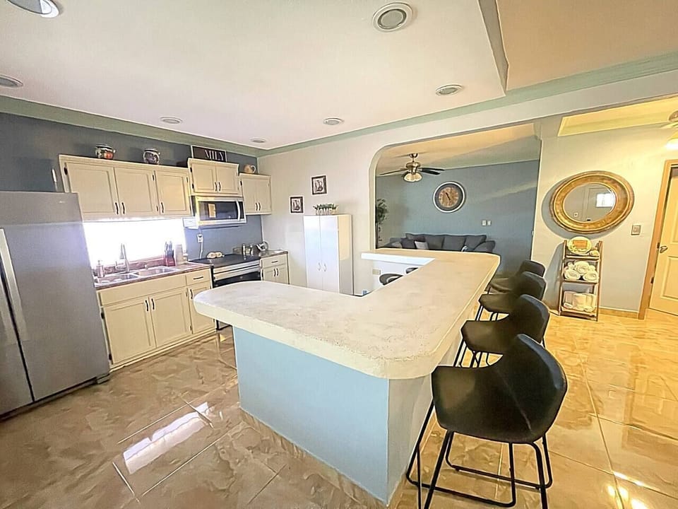 Spacious kitchen with island bar seating