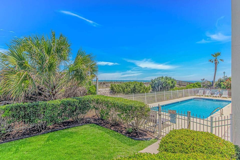 Relax by the beachfront pool while enjoying views of the Atlantic Ocean.