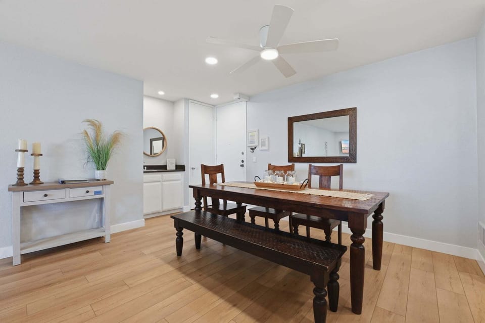 Perfect for longer sit-down meals, the dedicated dining table accommodates 6 guests comfortably, ensuring everyone has a spot to share stories about their day at the beach.