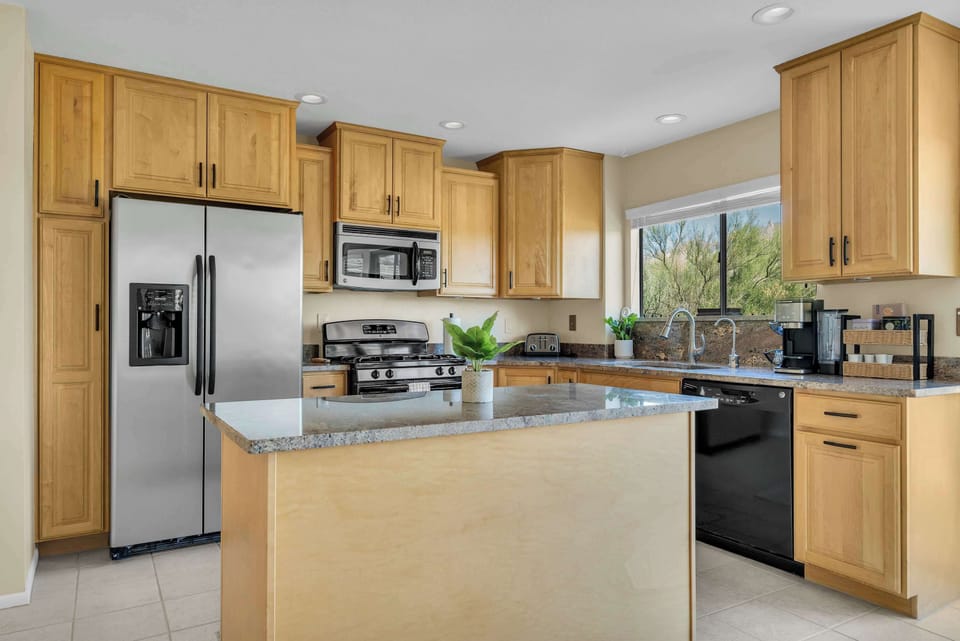 Fully Equipped Kitchen
Cook with ease in the spacious kitchen featuring stainless steel appliances, a large center island, generous counter space, and everything you need to prepare meals during your stay.
