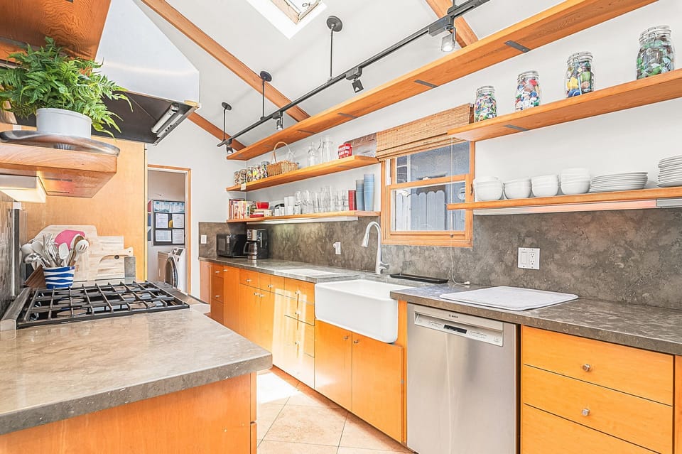 Well-appointed chef's kitchen with generous prep space and high-end cooking amenities
                