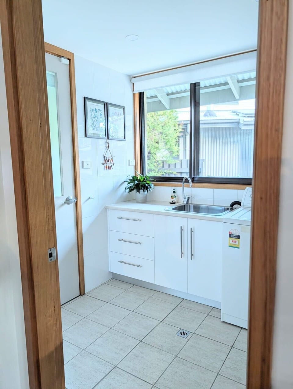 Full laundry facilities with washing machine, dryer and clothes line
