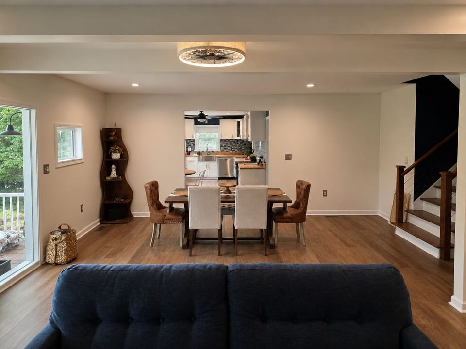 Open main-level living and dining space with comfortable seating, natural light and room to gather.