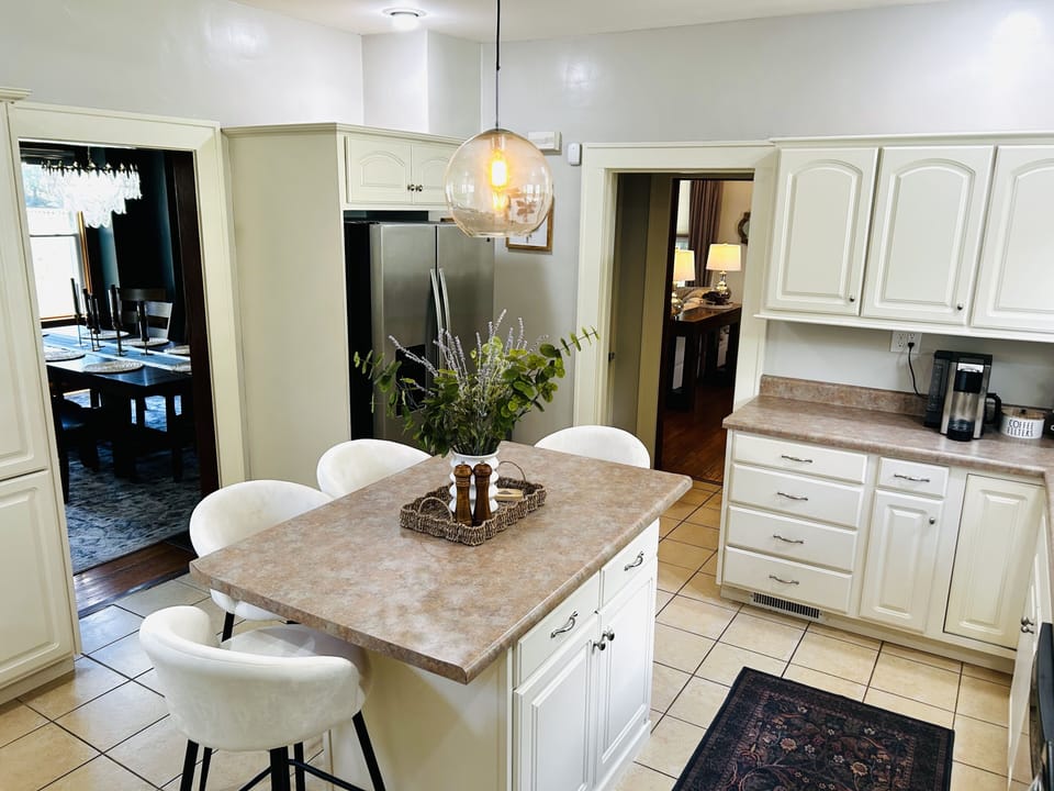 Bright kitchen with island seating and charming classic finishes