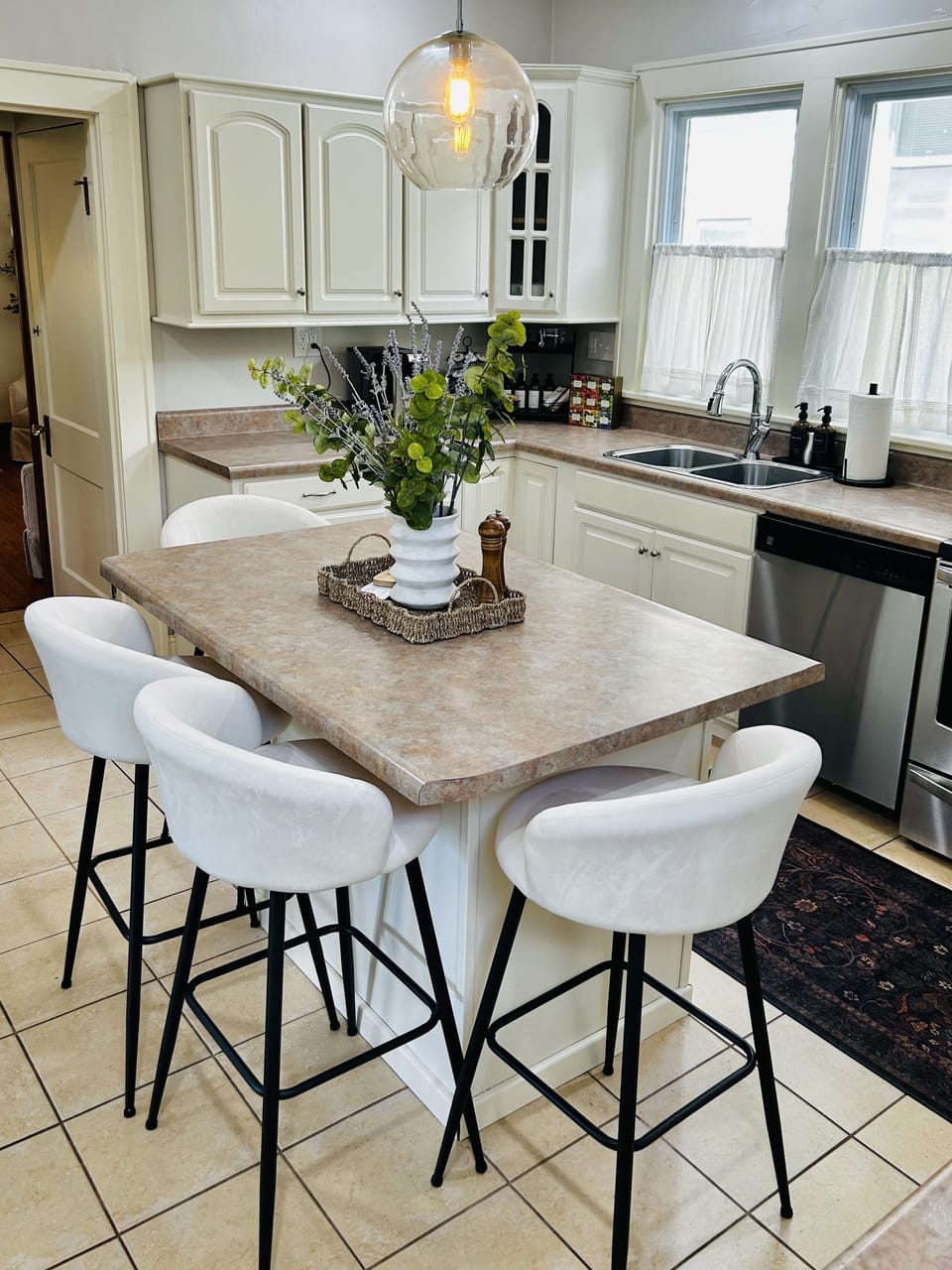 Bright kitchen with island seating for 4 and plenty of natural light