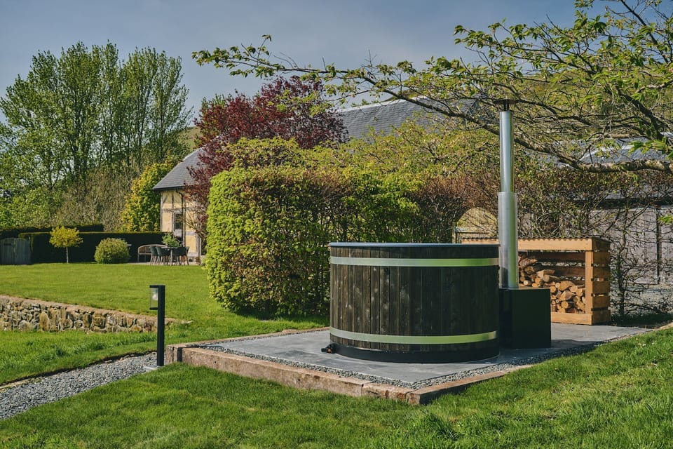 A wood fired hot tub at Original Hideaways, Powys
