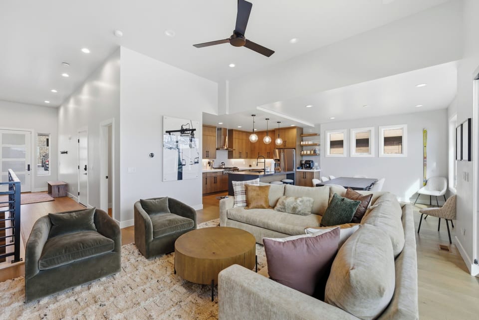 Gather in the spacious open-concept living area, with the kitchen and dining space close by.
