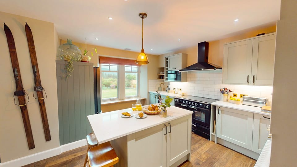 Bright and well-equipped, the kitchen has everything a group needs to cook up a storm after a day of Highland adventures.