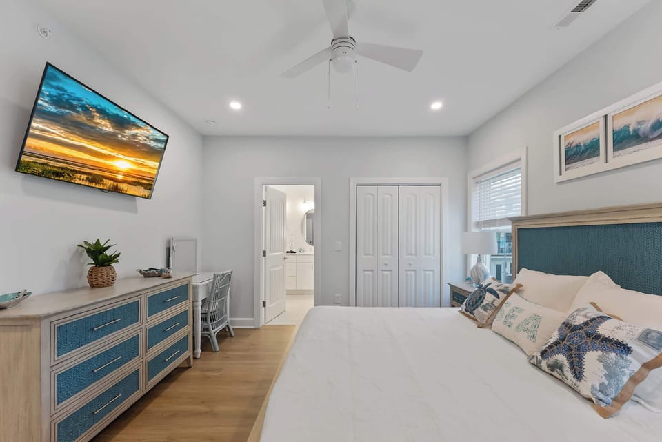 Comfortable king suite with a smart TV, ample storage, and private bathroom access.