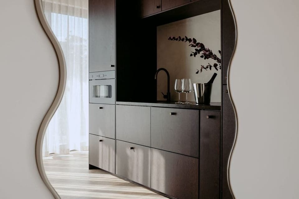 Architectural reflections and clean lines create a gallery-like feel.