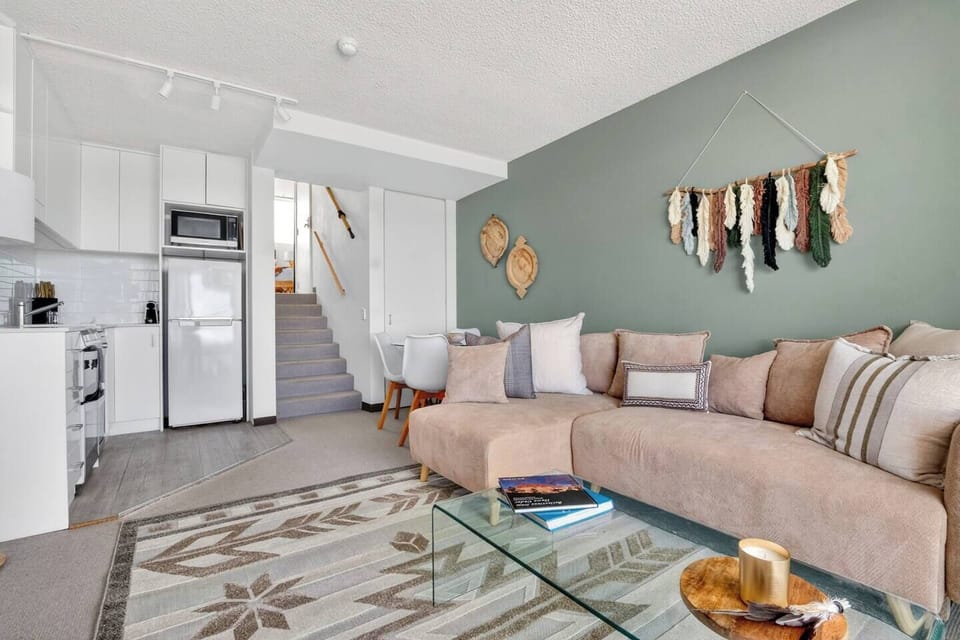 The split-level design separates rest from relaxation, creating an open social hub below and a private retreat upstairs.